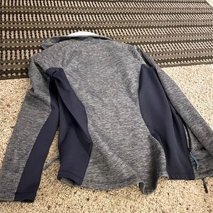 The North Face blue and grey zip up sweatshirt. Size small, great condition!